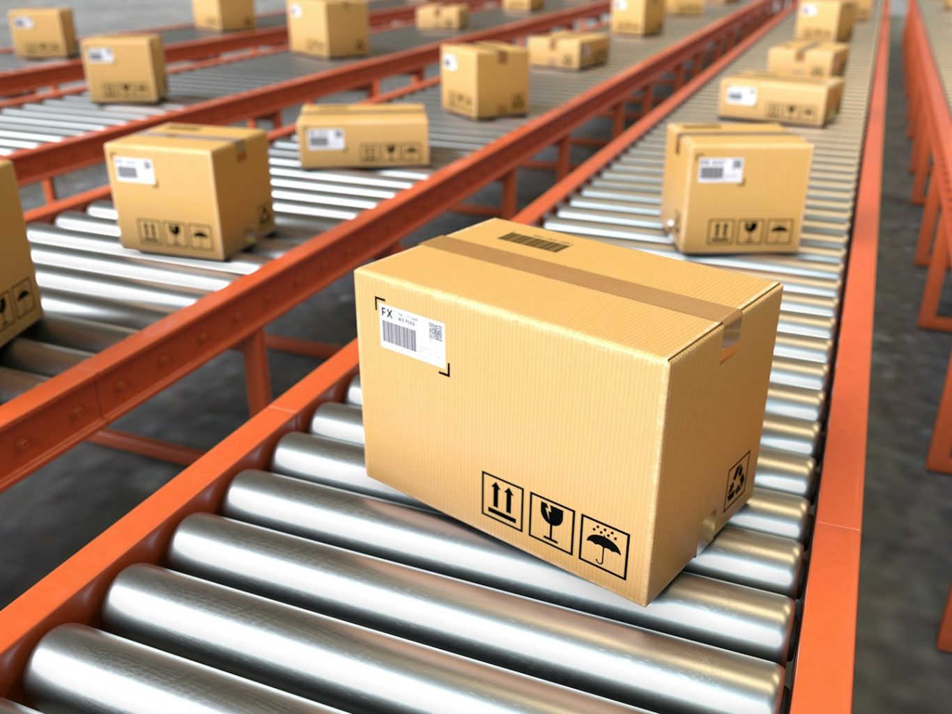 Everyone in the supply chain Cardboard boxes on a conveyor belt in a warehouse setting.